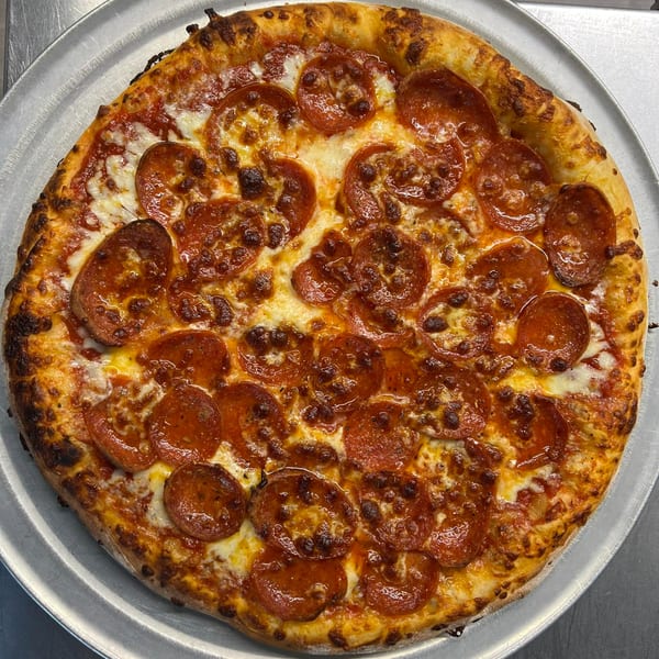 A whole pepperoni pizza from Pizzeria 131, with a golden crust and melted cheese.